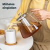 Teekanne aus Glas mit Stövchen